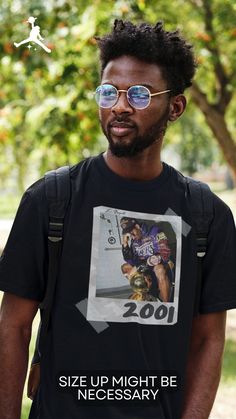 a man wearing sunglasses and a t - shirt that says, size up might be necessary