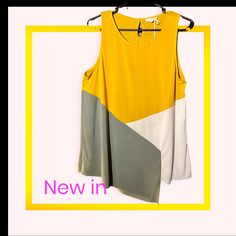 New With Tags Mysteree Brand Size Large Tri-Color Tank In Mustard, Grey & White With Keyhole Button Back (Extra Button Included), Cool Asymmetrical Hem In The Front Of Shirt. Made Of 70% Modal, 30% Polyester. Super Soft Fabric And Beautiful Colors. Lightweight Fabric. Great Summer Colors Gray Color Block Top For Summer, Yellow Tops With Asymmetrical Hem For Spring, Gray Color Block Summer Top, Trendy Multicolor Sleeveless Camisole, Spring Yellow Tops With Asymmetrical Hem, Summer Color Block Sleeveless Tops, Summer Sleeveless Color Block Tops, Spring Sleeveless Color Block Tops, Color Block Stretch Sleeveless Top