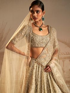 Unveil the allure of this silver green lehenga set, adorned with persian-inspired tree motifs symbolizing growth. This captivating ensemble, featuring a lehenga, blouse and dupatta is your ticket to turning heads at any occasion. Double Dupatta, Ridhi Mehra, Green Lehenga, Embroidered Crop Tops, Lehenga Blouse, Blouse Length, Black Bow, Indian Design, Handmade Clothes