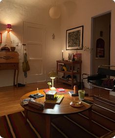 a living room filled with furniture and a wooden table in front of a mirror on the wall