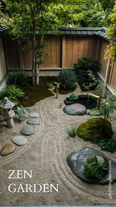 a small garden with rocks and plants in the center, surrounded by graveled paths