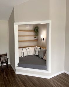 a bed sitting in the corner of a room