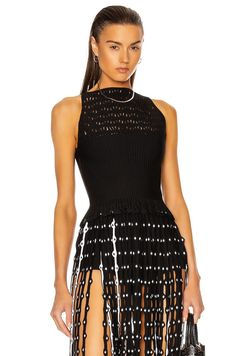 Find ALAÏA Knit Lace Sleeveless Top In Black on Editorialist. ALAÏA Knit Lace Sleeveless Top in Black 76% viscose 20% poly 3% polyamide 1% elastan. Made in Italy. Dry clean only. Hidden side zip closure. Boat neckline. Bandage waist. Loose knit lace yoke. Fringe trim along hem. ALIA-WS21. AA9H1010CM601. About the designer: The late Azzedine Alaïa had a comprehensive understanding of the female form, thanks to an education in sculpture from École des Beaux-Arts. Revered for his bodycon silhouettes that defined the aesthetic of Paris in the ‘80s, the Tunisian designer was also known for his intricate footwear, statement bags and laser-cut accessories. Statement Bags, Azzedine Alaïa, Lace Sleeveless Top, Knit Lace, An Education, Loose Knit, Boat Neckline, Fringe Trim, Lace Knitting