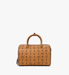 30 cm / 12 in Essential Boston Bag in Visetos Original Cognac | MCM® US 2023 Lifestyle, Speedy Bag, Mcm Logo, Long Haul, Essential Bag, Short Trip, Hand Wrap, Boston Bag, Small Detail