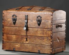 an old wooden trunk with metal handles