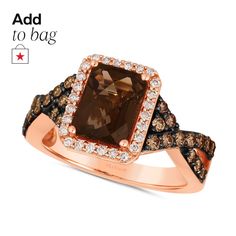 a brown and white diamond ring on top of a rose gold plated silver band