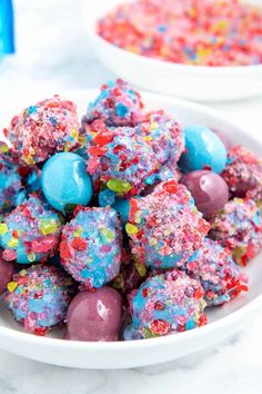 a bowl filled with colorful sprinkles next to another bowl full of candy