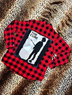 The Cure Flannel is a one-of-a-kind piece featuring a bold back patch cut from an iconic band t-shirt. Show off your love for The Cure in style with this unique and eye-catching piece. Each flannel is unique and adds a touch of edge to any outfit. Size Reference: Men's Large Hand sewn, distressed and up/down-cycled in Brooklyn Rock N’roll, Band T Shirts, Rock'n Roll, Back Patch, Number 2, Rock N, Full Sleeve, Rock N Roll, Hand Sewn