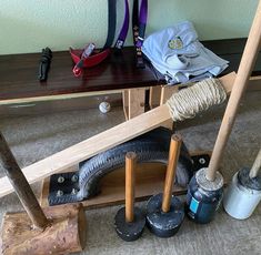 various items are placed on the floor next to each other in front of a bench