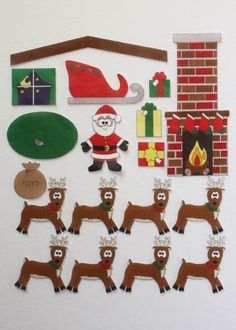 a christmas bulletin board with reindeers and santa clause on it's head, surrounded by other decorations