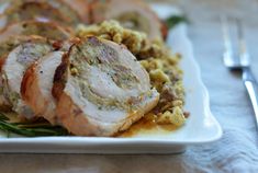 a white plate topped with meat and vegetables