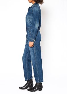 This denim jumpsuit offers a stylish look with reliable comfort. Constructed from 100% cotton, it provides a secure fit while remaining breathable.Model is 5'10" wearing size small. Approx. Body Length: 54 1/2", Sleeve Length: 23 1/2"Approx. Knee: 19", Leg Opening: 16 1/2" 100% Cotton Made in USA Fits true to size. Long Sleeve Denim Jumpsuit, Workwear Style, Baggy Shorts, Jumpsuit Jacket, Workwear Fashion, Kick Flares, Denim Style, Denim Jumpsuit, Curator Style