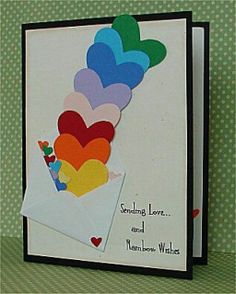 a handmade card with hearts on it and the words sending love and rainbow wishes