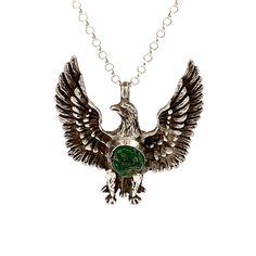 Vintage Southwestern Sterling Silver Eagle Turquoise Pendant - Unleash the power of the Eagle Spirit with this Sterling Silver cast pendant, adorned with a stunning green Turquoise Nugget. Aged to perfection, this unique piece is a must-have for any powerful necklace stack. Stone: Turquoise Setting: 1.75" L x 1.5"W Metal: Sterling Silver Weight: 12.0 Grams Includes 16" SS Rolo Chain This listing is for (1) Pendant only Explore our curated selection of Vintage Pendants + Necklaces here. Discover the entire 'Silver Raven' Vintage Collection for yourself. Southwestern Style Green Jewelry With Large Pendant, Southwestern Style Green Necklace With Large Pendant, Southwestern Green Turquoise Necklace With Large Pendant, Southwestern Turquoise Necklace With Large Green Pendant, Green Turquoise Pendant Necklace With Spiritual Style, Southwestern Green Jewelry With Large Pendant, Green Southwestern Jewelry With Large Pendant, Green Turquoise Necklace With Large Southwestern Pendant, Southwestern Green Necklace With Large Pendant