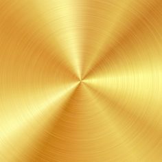 a gold metal background with some light shining on it's surface and the center in the middle