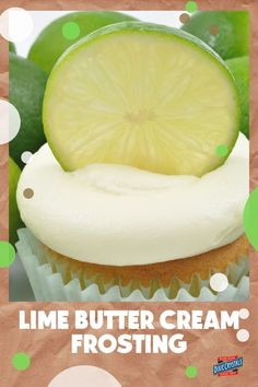 lime butter cream frosting on top of a cupcake with a slice of lime