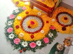 an arrangement of flowers and petals on the floor