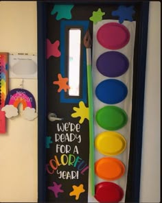 there is a door decorated with different colors and shapes for kids to use in the classroom