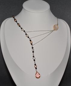 3 Silver plated chains connected asymmetrically to 15 Baroque freshwater pearls accented with 30 garnet-colored glass beads by a pink and gold glass connector finished with a rose pink bezel set faceted teardrop. Elegant Wire Wrapped Dangle Drop Necklace, Elegant Pink Wire Wrapped Necklace, Wire Wrapped Drop Jewelry For Party, Rose Gold Wire Wrapped Jewelry For Party, Elegant Pink Pearl Necklace With Beaded Chain, Wire Wrapped Briolette Jewelry For Party, Asymmetrical Necklace, Gold Glass, Cool Necklaces