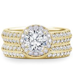 a yellow gold engagement ring set with two rows of diamonds