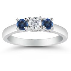 three stone diamond and blue sapphire engagement ring in white gold with diamonds on each side