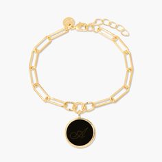 Bold and beautiful, this personalized enamel initial charm bracelet makes a statement with any outfit. Available in three stunning colors, the enamel is personalized with your or a special someone’s initial. The charm hangs elegantly from a modern, elongated link chain. Give as a gift or treat yourself! Available in 14k gold plated brass Enamel filled pendant measures 5/8" 6" elongated link chain with 1" extender Lobster claw closure With engraving this item is FINAL SALE SKU: BYB1106 Elegant Charm Bracelet With Logo Charm As Gift, Modern Jewelry With Logo Charm For Gifts, Elegant Charm Bracelet With Adjustable Chain As Personalized Gift, Elegant Metal Charm Bracelet With Logo Charm, Initials Charm Bracelet Gift, Elegant Chain Bracelet With Initials For Gift, Elegant Initials Chain Bracelet As Gift, Elegant Personalized Paperclip Bracelet For Everyday, Elegant Initials Charm Bracelet Gift