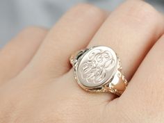 We've created this lovely ornate piece, from two antique components creating one lovely statement piece! An antique oval top with scrolling "FGB" initials in French script has been soldered atop an antique mounting with ornate motifs along its shoulders. The lovely monogram of this signet ring is so beautifully engraved and entwined that it makes a lovely image, regardless of their initials! Metal: 10K Yellow Gold Top Measurements: 11 x 14 mm, Oval Monogram: "FGB" in French Script Ring Size: 10 Yellow Gold Sapphire Ring, Gold Statement Ring, Cameo Ring, Gold Top, Gold Signet Ring, July Birthstone, Unisex Ring, Signet Ring, Eternity Bands