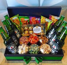 a gift box filled with beer, snacks and candies for someone's special occasion