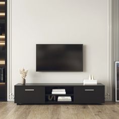 a flat screen tv mounted to the side of a wall in an empty living room