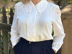 This is a gorgeous retro style blouse, perfect to add to a vintage wardrobe. It features a button down collar which can either be worn unbuttoned, or buttoned together for a flattering look. The blouse is also has an embroidered panel down the front. In great condition with no defects found. Best fits a size 10. Measurements: sleeve length: 56cm shoulders: 37cm chest: 52cm waist: 52cm hip: 52cm length: 61cm White Long Sleeve Blouse, Vintage Wardrobe, Retro Mode, Style Blouse, Retro Stil, Button Down Collar, Style Retro, White Long Sleeve, Retro Style