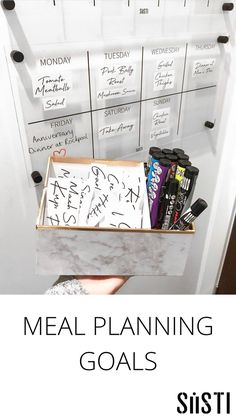 the meal planning goal is shown in front of a whiteboard with writing on it