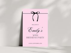 a pink birthday party card with a bow on it