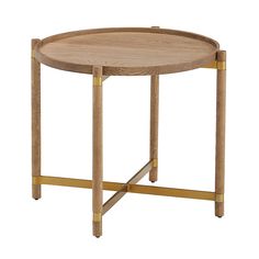 a round wooden table with gold legs