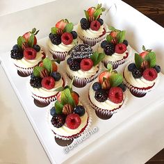 there are many cupcakes with fruit on them