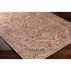 an antique style rug on a wooden floor