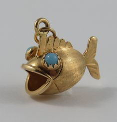 Amulets And Talismans, Turquoise Eyes, Fish Pendant, Family Jewels, Gold Fish, Gold Charms, Sell Gold, Jewelry Charms, Funky Jewelry