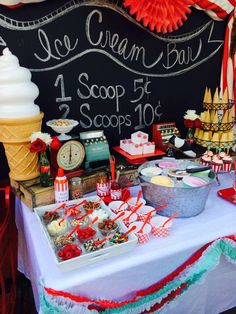 a table topped with lots of desserts and ice cream