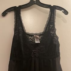 Black Nighty With Pleated Detail At Back And Front And Lace Top. Ties At Back. So Pretty. Pictures Don’t Do It Justice. New Without Tags Black Sleeveless Sleepwear With Lace Trim, Black Sleep Top With Built-in Bra, Black Lace Sleepwear For Loungewear, Black Cami Sleepwear For Lounging, Black Cami Sleepwear For Loungewear, Black Sheer Camisole Sleepwear, Black Sheer Tops For Night, Black Lace Trim Sleep Top, Black Sheer Camisole For Night