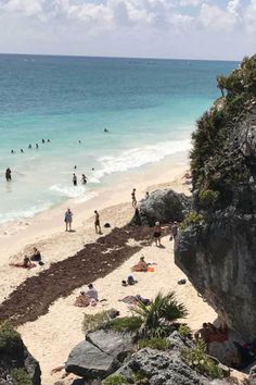 people are on the beach and in the water at this time of day with text overlay