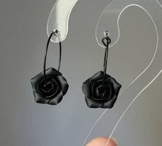 Absolutely black hoop earrings and Necklace  with matt black flowers. Each petal of flower made by hand Flower's size approx 15mm/0.6 in across Length of necklace is adjustable 17,5+ 2 in / 45 +5 cm Dia hooop 25 mm/ 1 inch SET: PENDANT WITH CHAIN AND EARRINGS Polymer clay isn't afraid of water, strong and flexible. Gorgeous gift as handmade item Metal bail in black color (Bails hole 6*4 mm/ 0,23*0,16 inch). ♥All my jewelry come in boxes or bags. If you are purchasing a gift I am happy to include personalized messages with your order. Please leave a note of desired message in the note to seller prior to placing your order. ♥ ALL PENDANTS- https://www.etsy.com/shop/BuduartJewelry?ref=seller-platform-mcnav§ion_id=22665063 If you like this item you can visit my shop: https://www.etsy.com/shop/ Nickel-free Black Hoop Earrings Gift, Black Nickel-free Hoop Earrings As Gift, Nickel Free Black Hoop Earrings Gift, Black Flower Shaped Earrings For Gift, Black Flower-shaped Earrings For Gift, Black Flower Earrings As Gift, Minimalist Matte Black Jewelry For Gifts, Minimalist Matte Black Jewelry Gift, Black Flower Drop Earrings For Gift