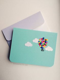 a card with an image of a hot air balloon in the sky on it's side