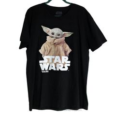 a star wars t - shirt with an image of baby yoda on the front