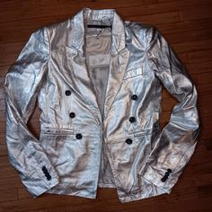 Metallic Silver Leather Blazer Size Small Sample. Casual Fitted Metallic Outerwear, Chic Metallic Outerwear For Formal Occasions, Metallic Outerwear For Work, Metallic Long Sleeve Blazer For Work, Chic Metallic Outerwear For Work, Chic Metallic Long Sleeve Blazer, Chic Long Sleeve Metallic Blazer, Metallic Fitted Formal Outerwear, Metallic Fitted Outerwear For Formal Occasions