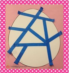 a paper plate with blue tape wrapped around it on a pink and white polka dot background