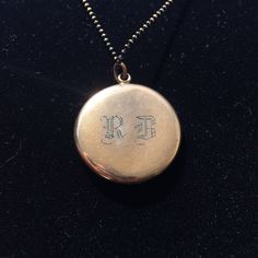 "This elegant Art Deco gold filled locket features a finely sculpted profile of a lovely lady surrounded by an oval ring of dark glittering paste stones and another ring of interesting engravings. The back of the locket has the initials \"RB\" engraved in Edwardian-style lettering. Inside, you can see the letters \"C, Q, and R\" in a small triangle which indicates the jewelry company who crafted this locket was the esteemed Carter, Qvarnstrom, & Remington of Attleboro, MA (they produced lock Victorian Round Locket Necklace Stamped 14k, Antique Oval Jewelry With Polished Finish, Heirloom Hallmarked Locket Necklace For Anniversary, Antique Oval Pendant Jewelry With Polished Finish, Formal Heirloom Locket Necklace Stamped 14k, Heirloom Locket Necklace For Anniversary, Victorian Yellow Gold Locket Necklace For Anniversary, Hallmarked Antique Gold Locket Necklace, Victorian Engraved Oval Cabochon Jewelry