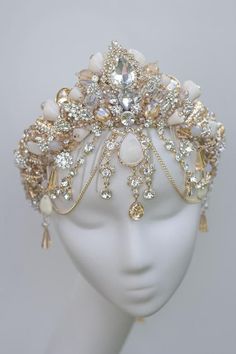 a white headpiece with lots of jewels on it