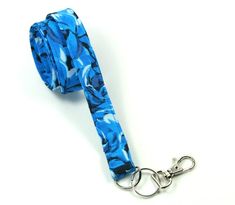 This cute lanyard has beautiful floral design. It is perfect for any occasion.You can leave me a convoy if you need a different size.You can have a wardrobe of lanyard to match your outfit. This lanyard is made of soft 100% cotton fabric to give a comfortable feel around your neck. This lanyard is easy to take care. You can spot clean and throw in a washer and hang dry. If you want you can iron and it is ready to use. These lanyards are perfect if you have metal allergy. Each of these lanyards w Blue Lanyard With Key Leash As Gift, Blue Lanyards With Key Leash As Gift, Blue Lanyard With Key Leash For Gift, Lanyard Blue, Cute Lanyard, Cute Lanyards, Fabric Lanyard, Have Metal, Badge Holder