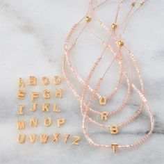 Initial Letter String Bracelets | Handmade by Libby & Smee Handmade String Bracelets, String Bracelets, Single Letter, Homemade Jewelry, Silk Cord, Letter Beads, String Bracelet, Initial Letter, Initial Letters