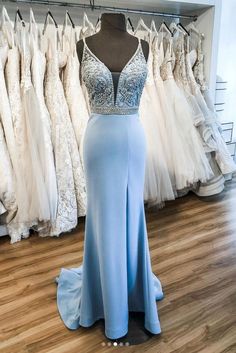 Blue V-neck Prom Gown, V-neck Homecoming Dress With Sweep Train, Light Blue Evening Dress For Homecoming During Prom Season, Light Blue Evening Dress For Homecoming And Prom, Light Blue Satin Evening Dress For Prom, Blue V-neck Evening Dress With Sweep Train, Light Blue Prom Season Evening Dress, Blue Satin Prom Evening Dress, Light Blue Floor-length Evening Dress For Homecoming