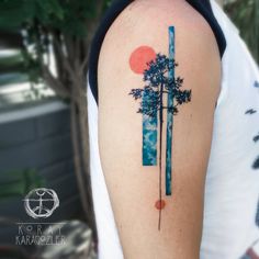 a person with a tree tattoo on their arm